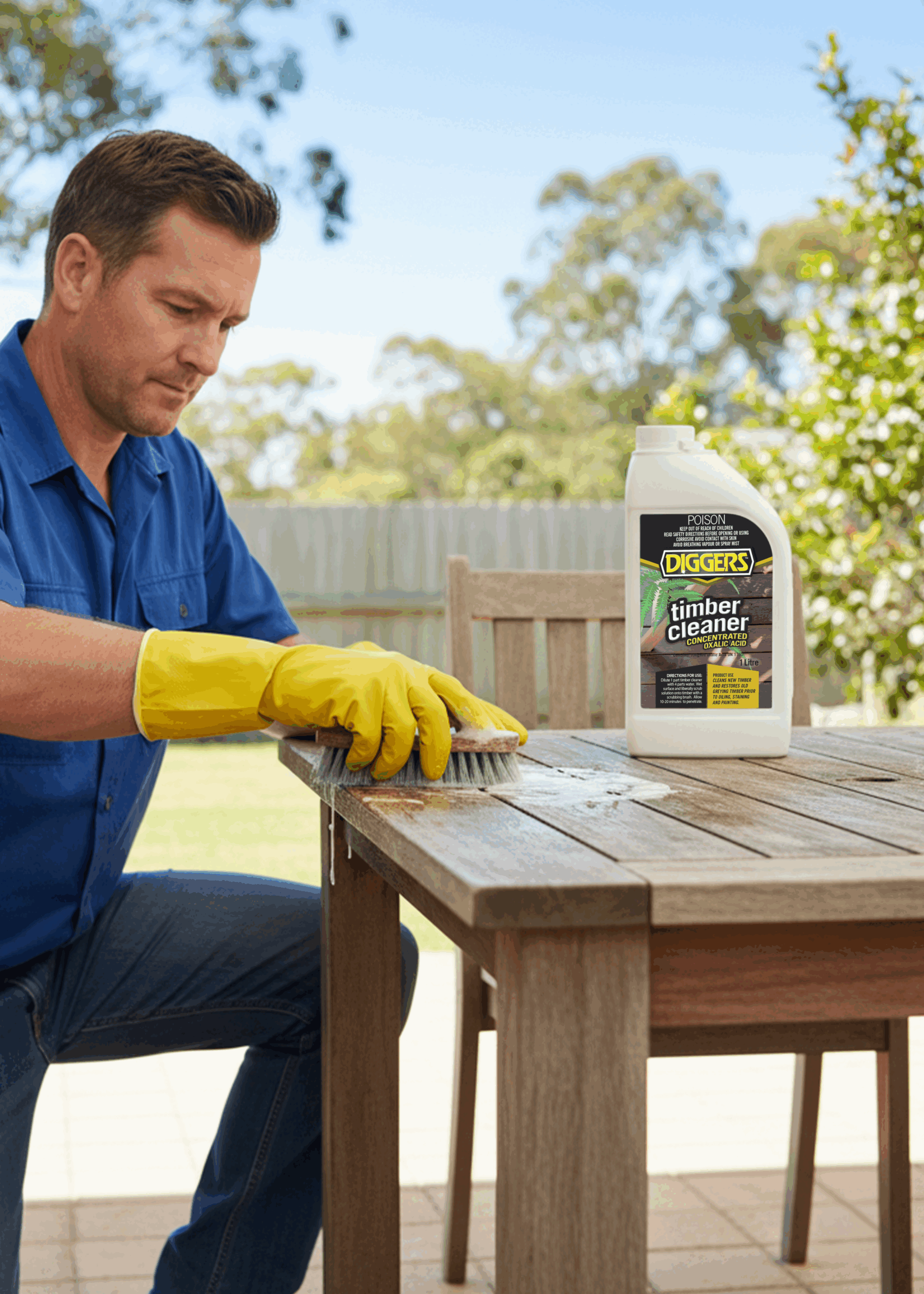 Man cleaning timber desk using Timber Cleaner (Concentrated Oxalic Acid)
