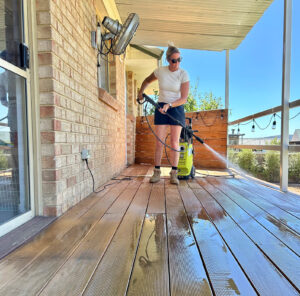 Image of Person Cleaning Timber Deck